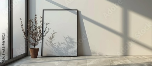 Blank frame mockup for your design on a white poster placed on the floor. This layout mockup can be used to preview your design. photo