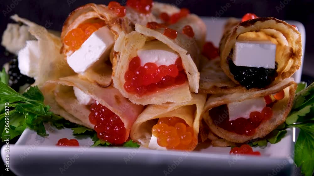 Red and black caviar Feta cheese serving a delicious appetizer dish in a restaurant Red and black caviar Feta cheese serving a delicious appetizer dish in a restaurant