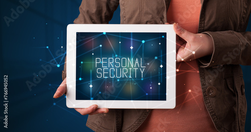 Person holding tablet, security concept