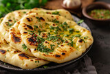 Indian naan bread with parsley on a plate