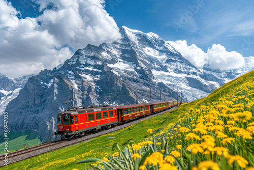 Red train passing through the Alps, lake and greenery in summer time. Luxury vintage passenger travel in the style of electric red cars for sightseeing tour of Europe