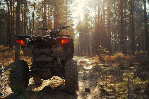 An ATV stands ready on a forest trail, promising off-road adventure and exploration.
