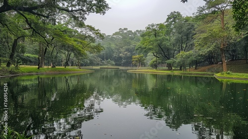 Atmosphere  A tranquil lake surrounded by lush greenery