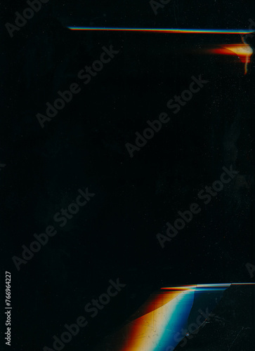 Damaged display. Broken glass. Dust scratch texture. Blue orange white rainbow color glow glitch distortion crushed aged effect on dark black illustration abstract background.