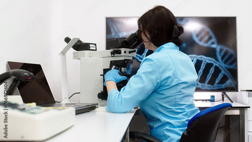 A scientist in a modern medical laboratory looks into a microscope. A doctor is a laboratory assistant in a modern laboratory with technological equipment. A scientist in a modern medical laboratory looks into a microscope. A doctor is a laboratory assistant in a modern laboratory with technological equipment.