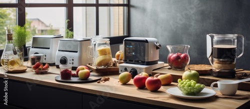 Blender, toaster, multi cooker and apple on wooden table in kitchen photo