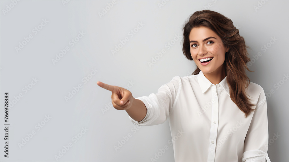 Mockup for advertising with happy female model, pointing to the side at background wall for marketing graphics, space for branding copy and sale deal announcement, blank background Mockup for advertising with happy female model, pointing to the side at background wall for marketing graphics, space for branding copy and sale deal announcement, blank background