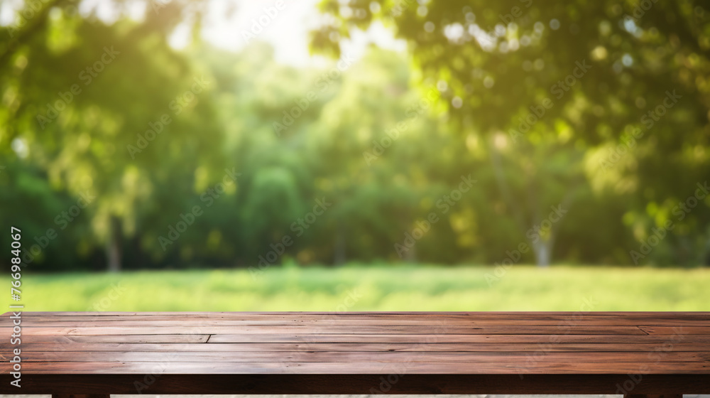 Wooden table in front of blurred nature background with bokeh Wooden table in front of blurred nature background with bokeh