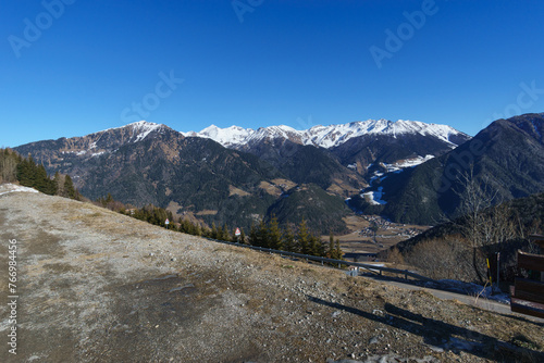 Idyllic view in the valley of alpine mountain landscape during winter time near the border of Austria on the pass road of Pennes, South Tirol, Italy