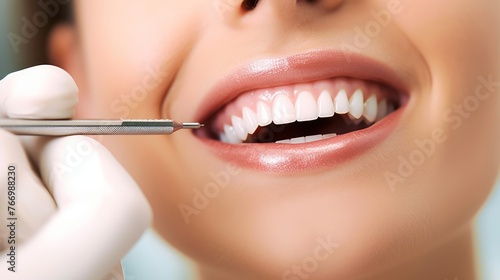 Smiling pretty woman is having her teeth examined by dentist in clinic.