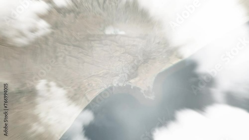 Earth zoom in from space to Al Mukalla, Yemen. Followed by zoom out through clouds and atmosphere into space. Satellite view. Travel intro. Images from NASA photo