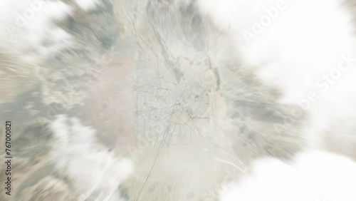 Earth zoom in from space to Zahedan, Iran. Followed by zoom out through clouds and atmosphere into space. Satellite view. Travel intro. Images from NASA photo