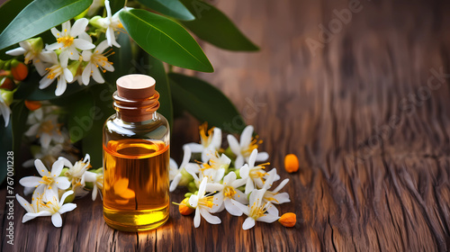 Essential massage oil in bottle with Flower in the Backround Spa