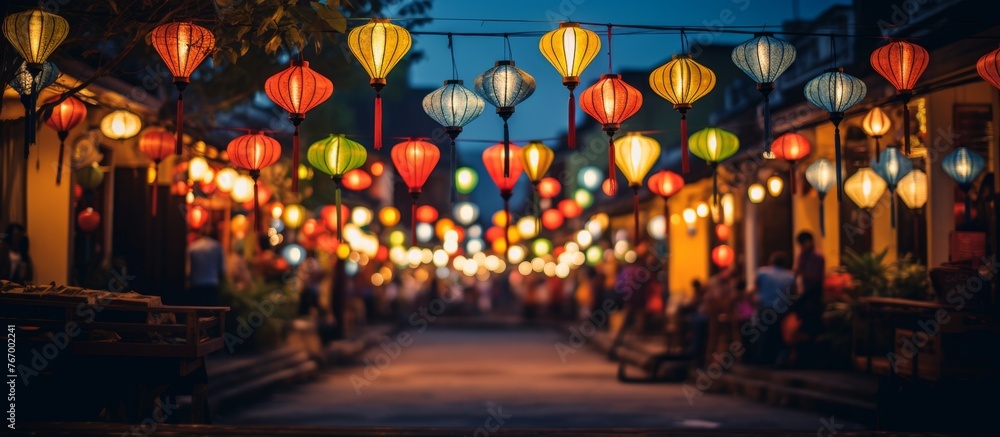 A city street adorned with vibrant lanterns illuminating the facade of buildings, creating a colorful display of art and design in the midnight hours