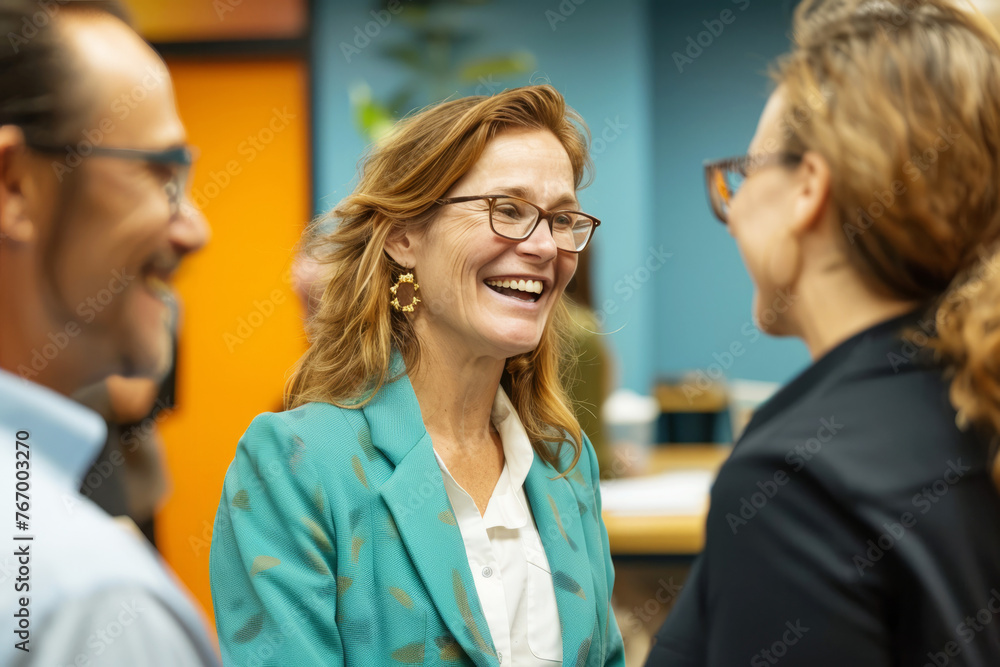 Smiling businesswoman engaging in a conversation with colleagues in a vibrant office setting Smiling businesswoman engaging in a conversation with colleagues in a vibrant office setting