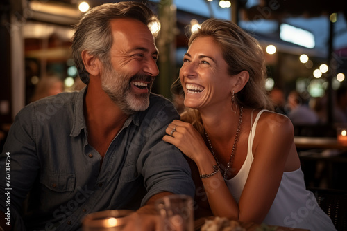 Romantic couple dating night smiling and laughing together having fun. Love and relationship adult people enjoying nightlife. Tourist on vacation. Outdoor leisure activity.