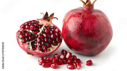 Juicy pomegranate displayed in isolation on white background.