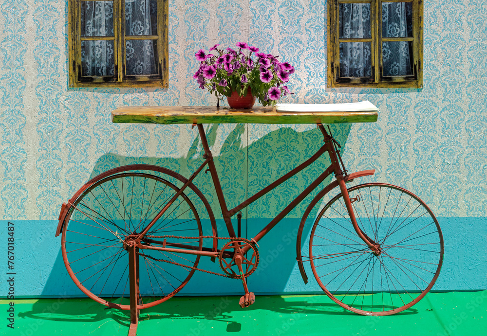 Vintage retro decorative table surface with bicycle frame as a base
