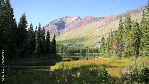 View of Grinnell Point from the banks of Swiftcurrent Lake in Glacier National Park photo