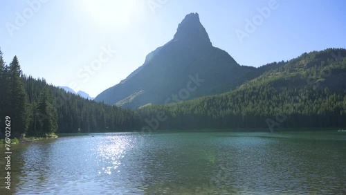 Grinnell Point in Glacier National Park viewed across lake, pan photo