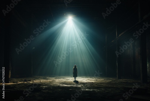 a person standing in a dark room with light shining through