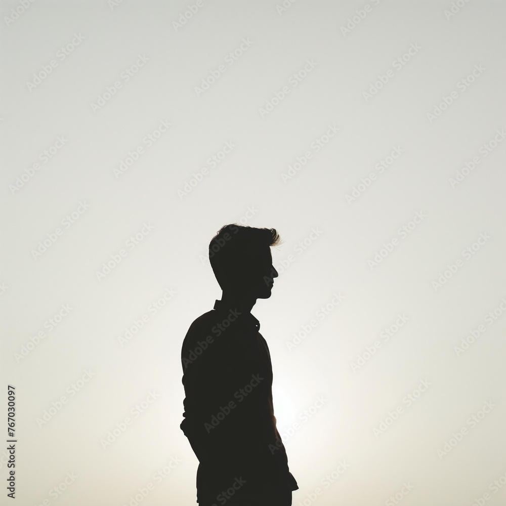 Silhouetted Young Man, Serene, Contemplation, Sunset Background
