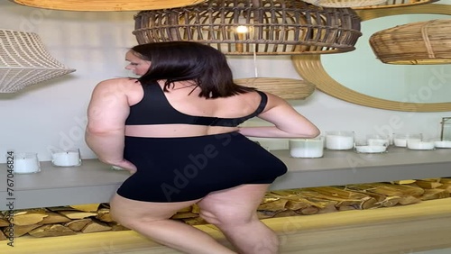 Beautiful pregnant woman in special pregnancy underwear. Advertisement of comfortable basic pregnancy underpants. Happy brunette girl show her panties in hall. Caucausian thin woman