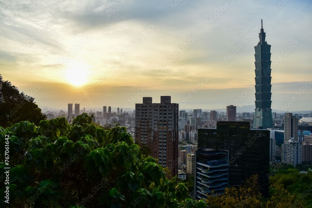 Aerial view of skyline of Taipei city with Taipei 101 Skyscraper at sunset from Xiangshan Elephant Mountain. Beautiful landscape and cityscape of Taipei downtown buildings and architecture in the city