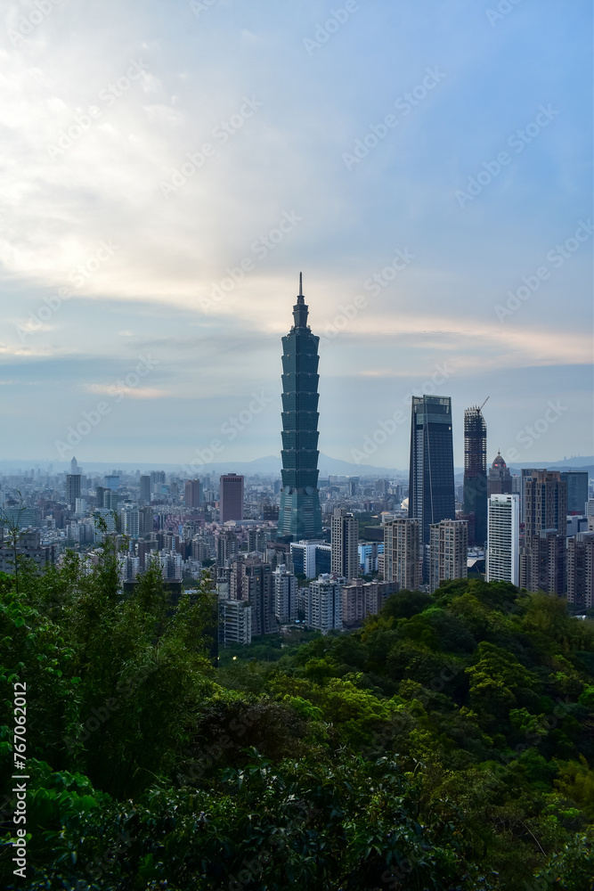 Aerial view of skyline of Taipei city with Taipei 101 Skyscraper at sunset from Xiangshan Elephant Mountain. Beautiful landscape and cityscape of Taipei downtown buildings and architecture in the city