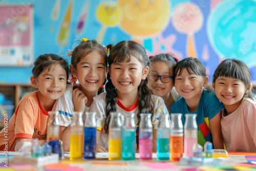A group of primary school students with Asian faces are doing experiments happily