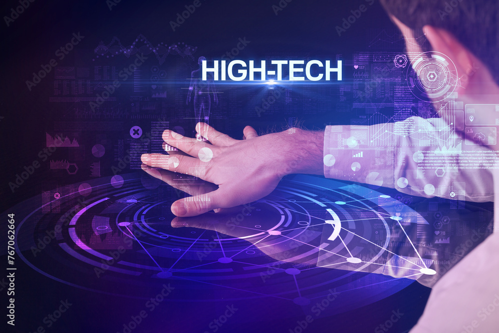 Businessman touching huge display Businessman touching huge display