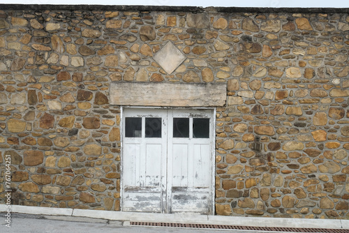 Rustic Abandoned Building With Stone Wall