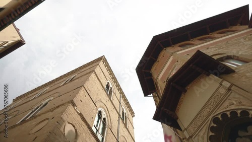 Florence ancient churches and cathedrals from the bottom view shot, brick buildings facade with architectural feature for tourists exploration, visiting famous Florence landmarks and sightseeings photo