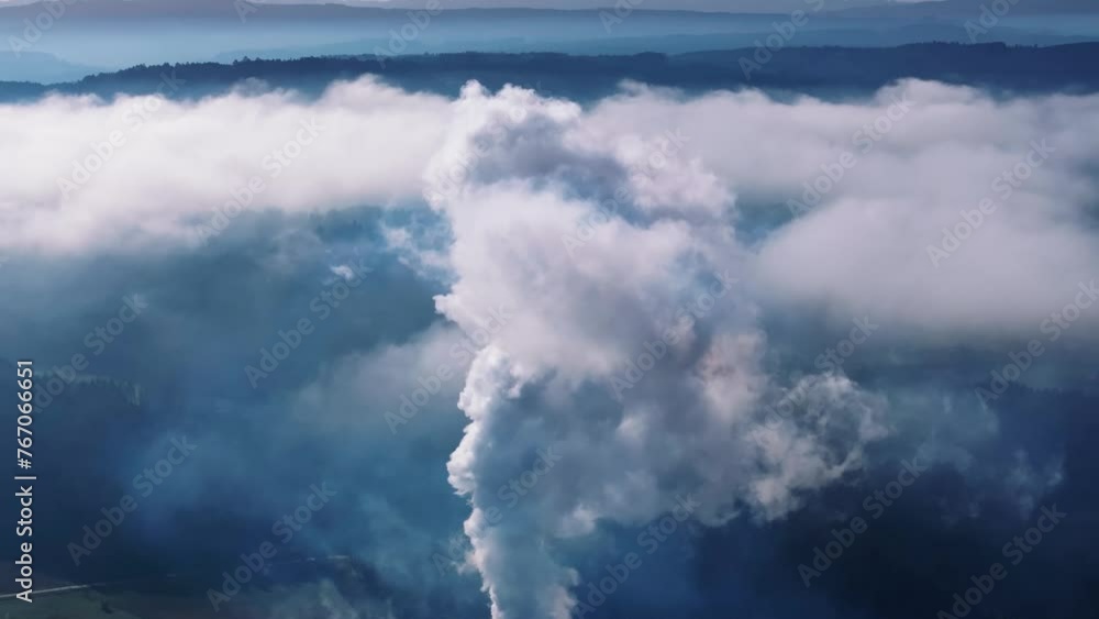 Smoke From Industrial Factory Billowing In The Atmosphere. Air Pollution Concept. aerial tilt-down shot Smoke From Industrial Factory Billowing In The Atmosphere. Air Pollution Concept. aerial tilt-down shot
