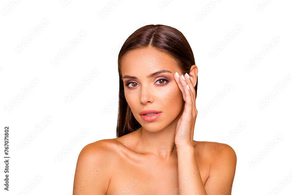 Portrait of graceful pretty well-groomed charming lovely lady with naked shoulders she look at camera touch her face near eye isolated on pastel beige background Portrait of graceful pretty well-groomed charming lovely lady with naked shoulders she look at camera touch her face near eye isolated on pastel beige background