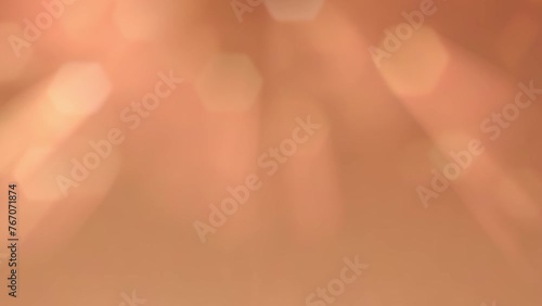 Beige background with hexagonal bokeh and rays of light.