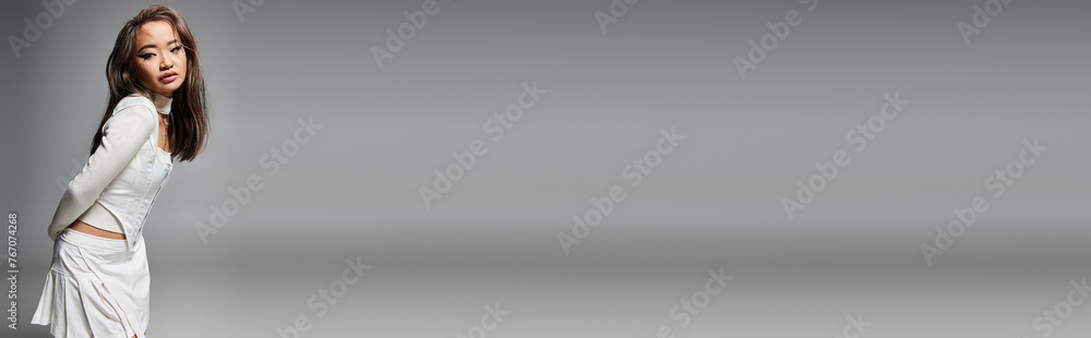 banner of asian young woman in stylish outfit with daring makeup sideways leaning forward banner of asian young woman in stylish outfit with daring makeup sideways leaning forward