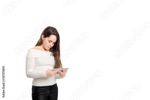 A woman is looking at a tablet