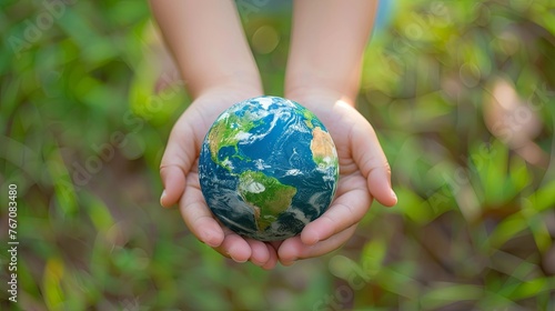 World Earth Day Concept. Green Energy, ESG, Renewable and Sustainable Resources. Environmental Care. Hands of People Embracing a Handmade Globe. Protecting Planet Together. Top View