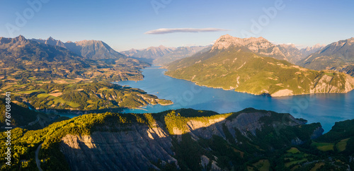 Serre-Poncon Lake and Durance Valley with Grand Morgon peak at sunset. Aerial view of Chanteloube Bay, Hautes-Alpes, Alps, France