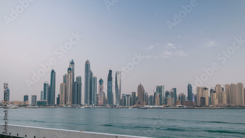 Dubai Marina skyline day to night timelapse as seen from Palm Jumeirah in Dubai, UAE.