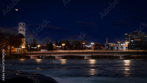 Night photo of town of Bihac in Bosnia and Herzegovina. River Una and the Bihać are part of National park Una with famous Strbacki Buk waterfall in Martin brod. photo
