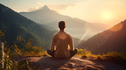 person meditating in the mountains