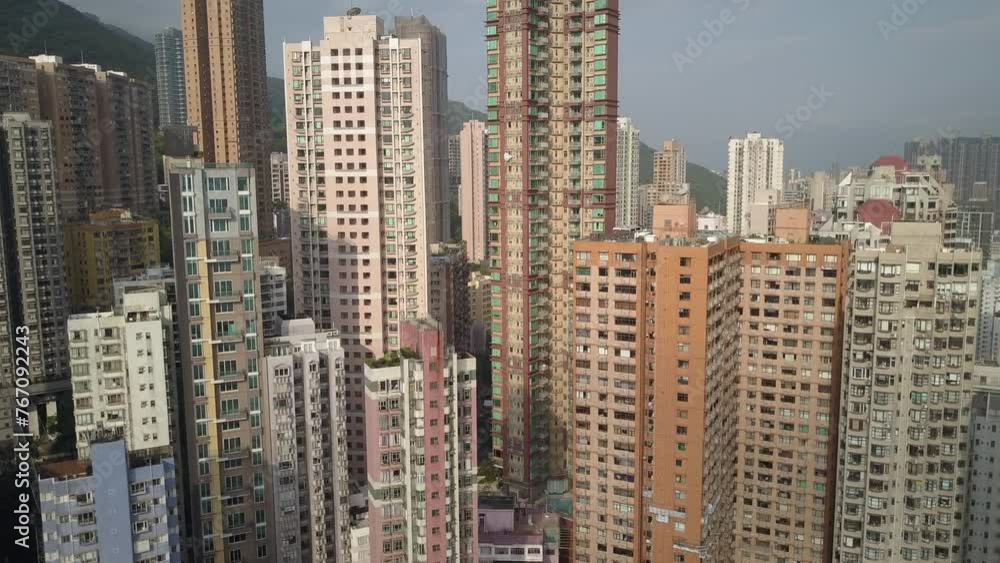 Aerial Panning Shot Of Modern Buildings In Residential City On Sunny Day - Hong Kong, China Aerial Panning Shot Of Modern Buildings In Residential City On Sunny Day - Hong Kong, China