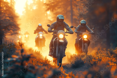 motorcycle bikers racers on sports enduro motorcycles in off-road race rally riding on road in forest at sunset