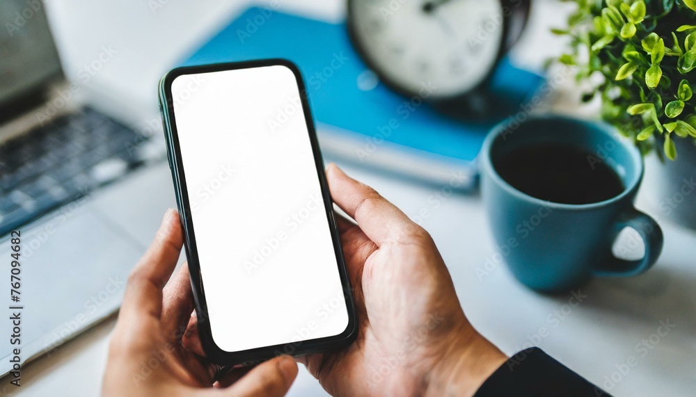 Mobile Phone for Mockup - Mobile Phone held by Hand in an Office or Cafe Environment - Template for Application Presentation Mobile Phone for Mockup - Mobile Phone held by Hand in an Office or Cafe Environment - Template for Application Presentation
