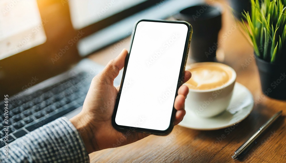 Mobile Phone for Mockup - Mobile Phone held by Hand in an Office or Cafe Environment - Template for Application Presentation Mobile Phone for Mockup - Mobile Phone held by Hand in an Office or Cafe Environment - Template for Application Presentation