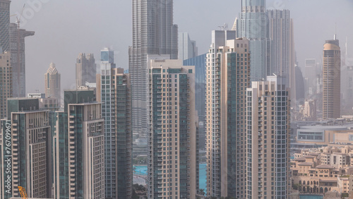Downtown Dubai skyline with residential towers timelapse  view from rooftop.