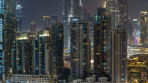Aerial cityscape timelapse at night with illuminated modern architecture in Downtown of Dubai  United Arab Emirates.