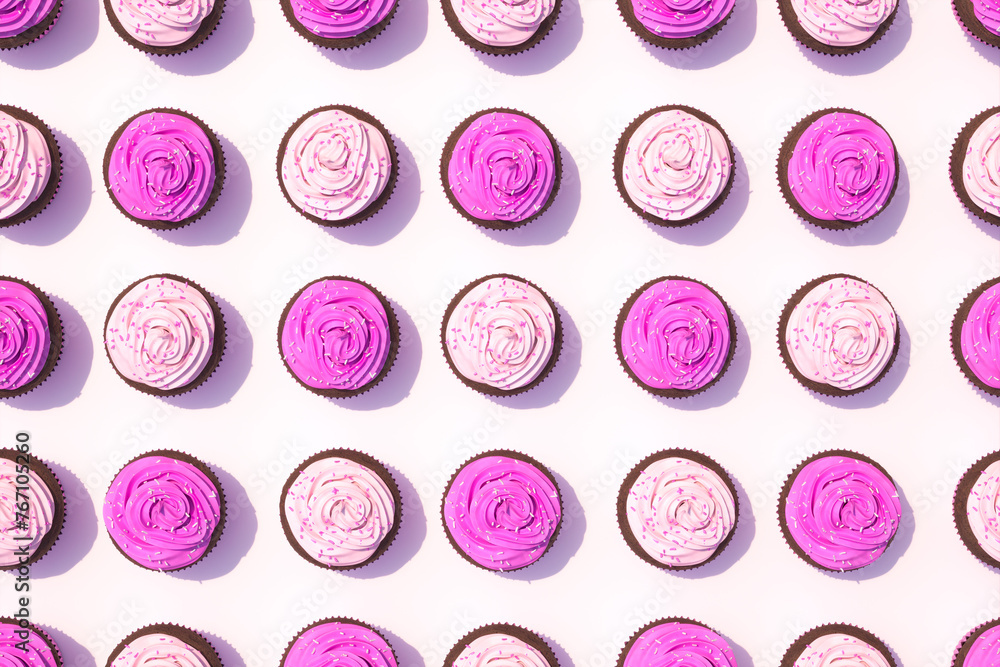 Overhead Arrangement of Vibrant Pink Frosted Chocolate Cupcakes on White